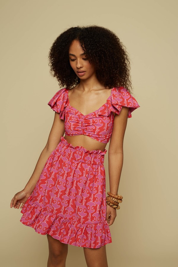 TECTON MINI SKIRT (PINK GEO PEOPLE PRINT)